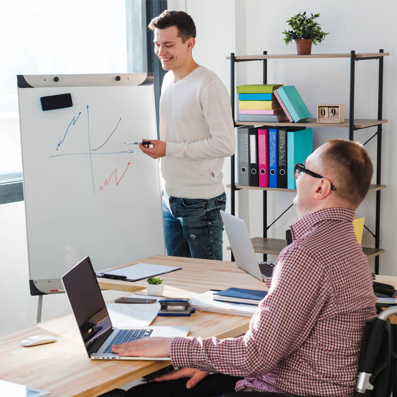 adult-male-presenting-project-whiteboard